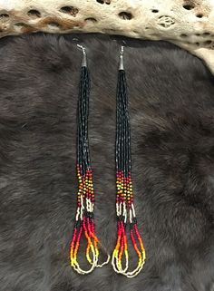 Authentic Beautiful Native American Indian Jewelry Navajo Hand Beaded Long Dangle Earrings. Great for a gift❤️ Handcrafted by Navajo Artist R. Sellers These beautiful earrings are 10" in length and 1" in width. Southwestern Dangling Beads For Jewelry Making, Southwestern Style Festival Beads With Dangling Details, Southwestern Style Black Beads Jewelry For Gift, Southwestern Style Black Bead Jewelry For Gifts, Southwestern Style Jewelry With Black Beads For Gift, Southwestern Style Beaded Earrings For Festival, Southwestern Style Multicolor Jewelry With Black Beads, Southwestern Style Handwoven Dangle Jewelry, Southwestern Black Beaded Dangle Earrings