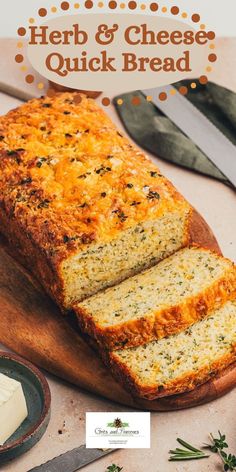 a loaf of herb and cheese quick bread on a cutting board