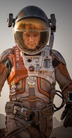 a man in an astronaut's suit and helmet