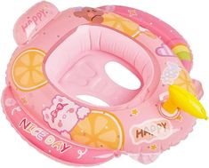 a pink inflatable float with an orange slice on the side and words happy new year