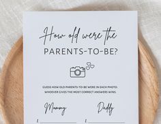 a sign that says how did we write the parents - to - be? on it