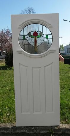 a white door with a stained glass window