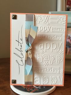 a happy birthday card with a bow on the front and an envelope in the back