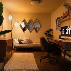 a living room filled with furniture and lots of mirrors on the wall above it's desk