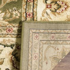 two rugs with different colors and patterns on them, one has a piece of wood