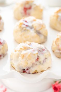 a white plate topped with cookies covered in icing