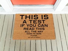 a door mat that says, this is a test if you can read this all the way down to here please