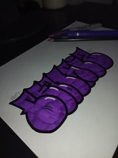 an image of graffiti written in purple on white paper next to a pencil and marker