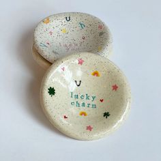 two bowls with the words lucky charm written on them