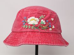 Item: flower embroidered bucket hat Material: 100% cotton Size: one size fits most Color: white, message me if you want to customize the pattern to another color Free first class shipping, upgradable priority mail service. 30 days return policy, feel confident at your purchase! Vintage Cotton Sun Hat, Vintage Cotton Hat For Festivals, Vintage Cotton Festival Hat, Pink Cotton Bucket Hat For Spring, Summer Bucket Hat With Embroidered Logo, Vintage Cotton Bucket Hat For Spring, Adjustable Pink Cotton Bucket Hat, Embroidered Bucket Hat For Beach, Pink Cotton Bucket Hat With Curved Brim