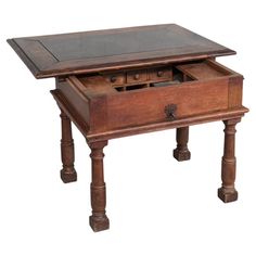 an old wooden desk with two drawers on one side and a drawer at the top