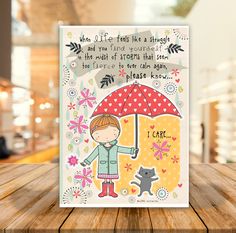 a card with an illustration of a girl holding an umbrella and a cat on it