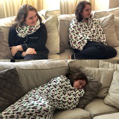 two women sitting on a couch covered in blankets