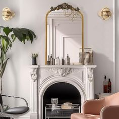 a living room filled with furniture and a fire place in front of a white fireplace