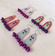 six different shaped earrings with beads on them