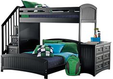 a black bunk bed with green and blue pillows