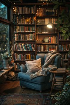 a blue chair sitting in front of a bookshelf filled with lots of books