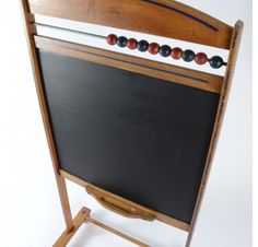 an old fashioned blackboard and wooden frame with beads on the back, sitting in front of a white background