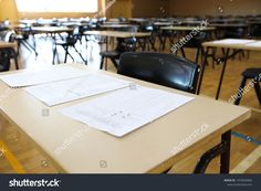 an empty classroom with desks and chairs