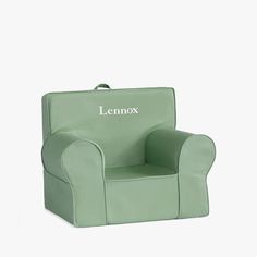 a green children's chair with the name lenox written on it, in front of a white background