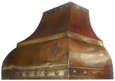 a copper colored stove hood with rivets on the sides