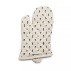 the oven mitt is white with blue diamonds on it