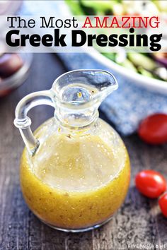 Glass bottle of Greek Salad Dressing with Greek salad ingredients in background. Greek Salad Dressing Recipe, Mediterranean Diet Recipes Dinners, Greek Dressing, Greek Salad Dressing, Easy Mediterranean Diet Recipes, Salad Dressing Recipes Homemade, Greek Salad Recipes