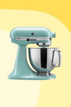 a blue mixer sitting on top of a yellow background