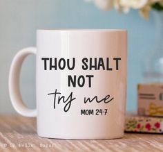 a white coffee mug with the words thou shall not try me mom 24 / 7