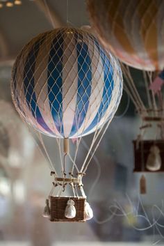 three hot air balloons are flying in the sky