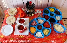 a table topped with lots of food and condiments