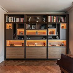 an empty room with many bookshelves and shelves filled with various items on top of them