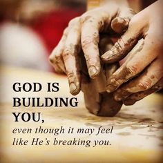 two hands touching each other with the words god is building you, even though it may feel like he's breaking you