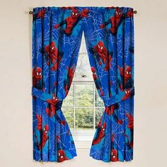 a window with spiderman curtains in front of it