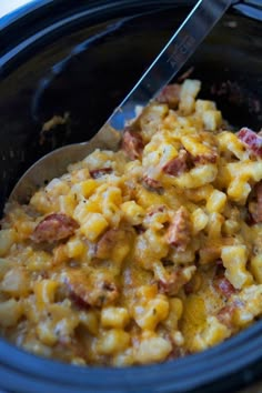 a bowl filled with macaroni and cheese on top of a table