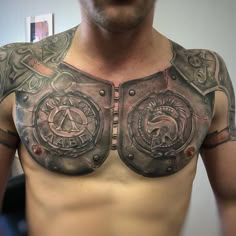 a man with some tattoos on his chest