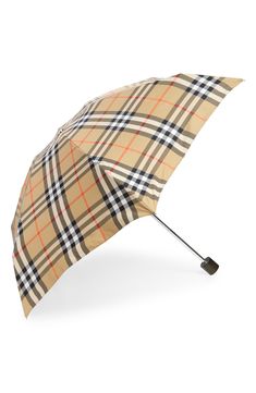 Rainy days don't stop the recognizable style of an iconic check umbrella and it's convenient handle-topped pouch. Includes umbrella and pouch Textile/metal Imported Rainy Day Umbrella, Burberry Umbrella, Brown Umbrella, Paris Umbrella Street, Coquette Umbrella, Umbrella Holder, Burberry, Umbrella