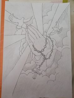 a drawing of a person's hands holding a rosary with two birds on it