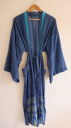 "Silk Polyester kimono robes are perfect for lounging around the home or spa. Use our silk robe as a cover up on the beach or after a dip in the pool. Add a luxe, boho feel to your bridal shower. Versatile, soft and luxurious, our silk kimono robes are printed with azo-free dyes. The silk Polyester robe features full sleeves, a waist tie and two front pocket. Length - 50 inches (125Centimeter), Measurements Approx : *Length: 50\" Inches *Bust Around Size: 50\" Inches *Shoulder: 8\" Inches *Sleev Bohemian V-neck Robe For Loungewear, Bohemian Open Front Kimono For Loungewear, Bohemian Open Front Robe For Loungewear, Bohemian Open Front Loungewear Robe, Multicolor Wrap Robe For Loungewear, Spring Long Robe For Home, Long Spring Robe For Home, Blue Long Sleeve Sleepwear For Vacation, Multicolor Wrap Robe For Vacation