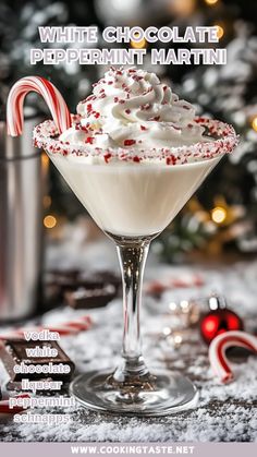 a white chocolate peppermint martini in a glass with candy canes on the side