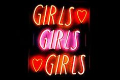 a neon sign that says girls love girls