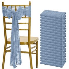 a stack of blue ruffled chair sashes next to a gold chiavar