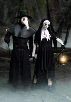 two people dressed in costumes standing next to each other