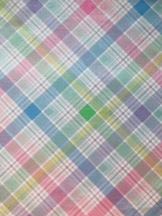 a multicolored plaid fabric with small squares