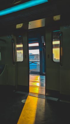 an open door on a subway car with the sun shining through it's windows