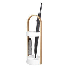 an umbrella stand with two umbrellas in it