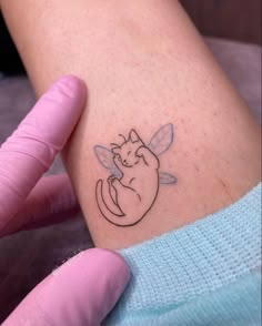 a person with a small tattoo on their arm