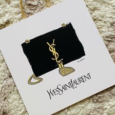 a card with an image of a handbag and the words, yes saint laurent