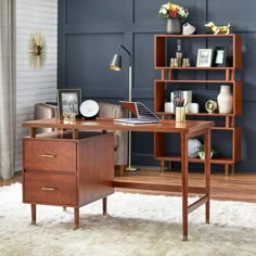 a wooden desk sitting on top of a white rug