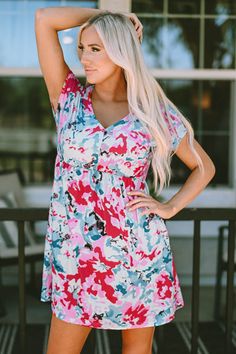 This vibrant floral dress can add a touch of elegance and romance to your life Its V-neck. short sleeves. and flowy fit are popular among young ladies The pockets are convenient for carrying small items Accessorize with a necklace. a sunhat. a... Short Sleeve Floral Dress, Blouse Jeans, Fiery Red, Floral Pants, Daily Dress, Neck Pattern, Boutique Dresses, Jeans Dress, Floral Dress